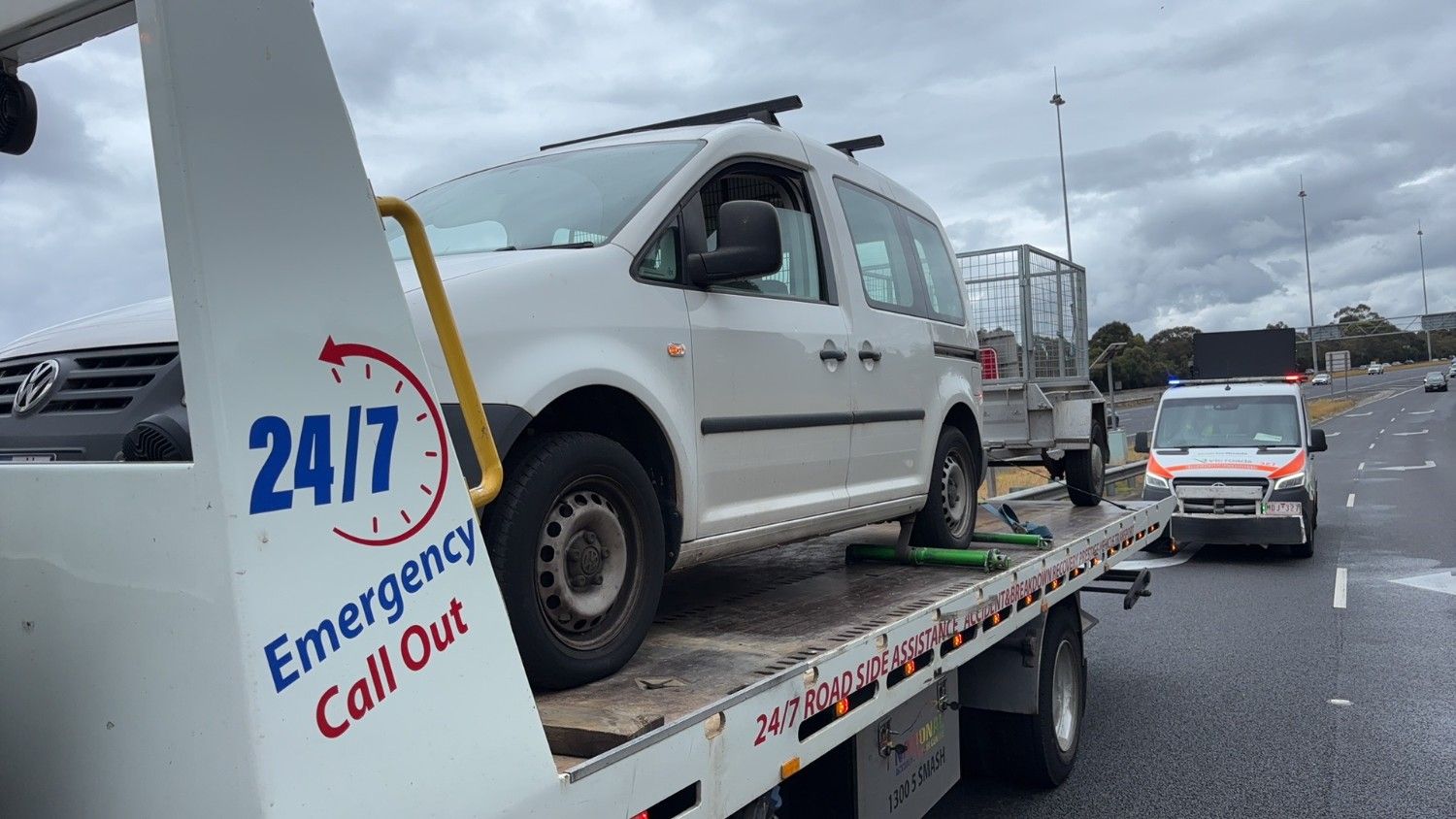 24/7 emergency car towing Melbourne service helping a white van on the roadside after breakdown