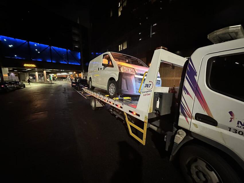 Towing Box Hill – white van loaded on tow truck at night