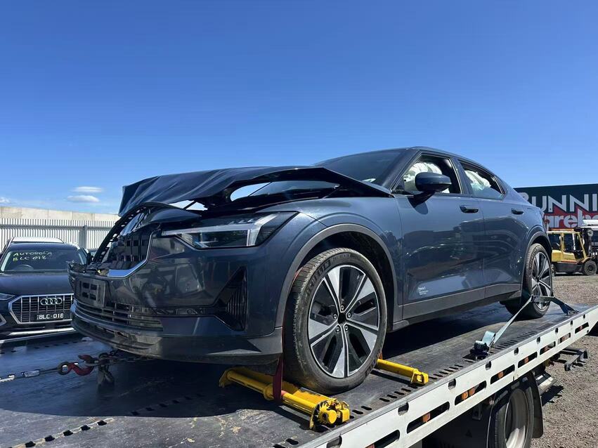 Towing Box Hill – damaged electric car on flatbed tow truck under daylight