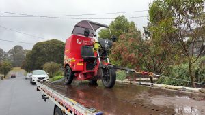 tow truck Melbourne loading a postal three wheel motorcycle for motorcycle towing service