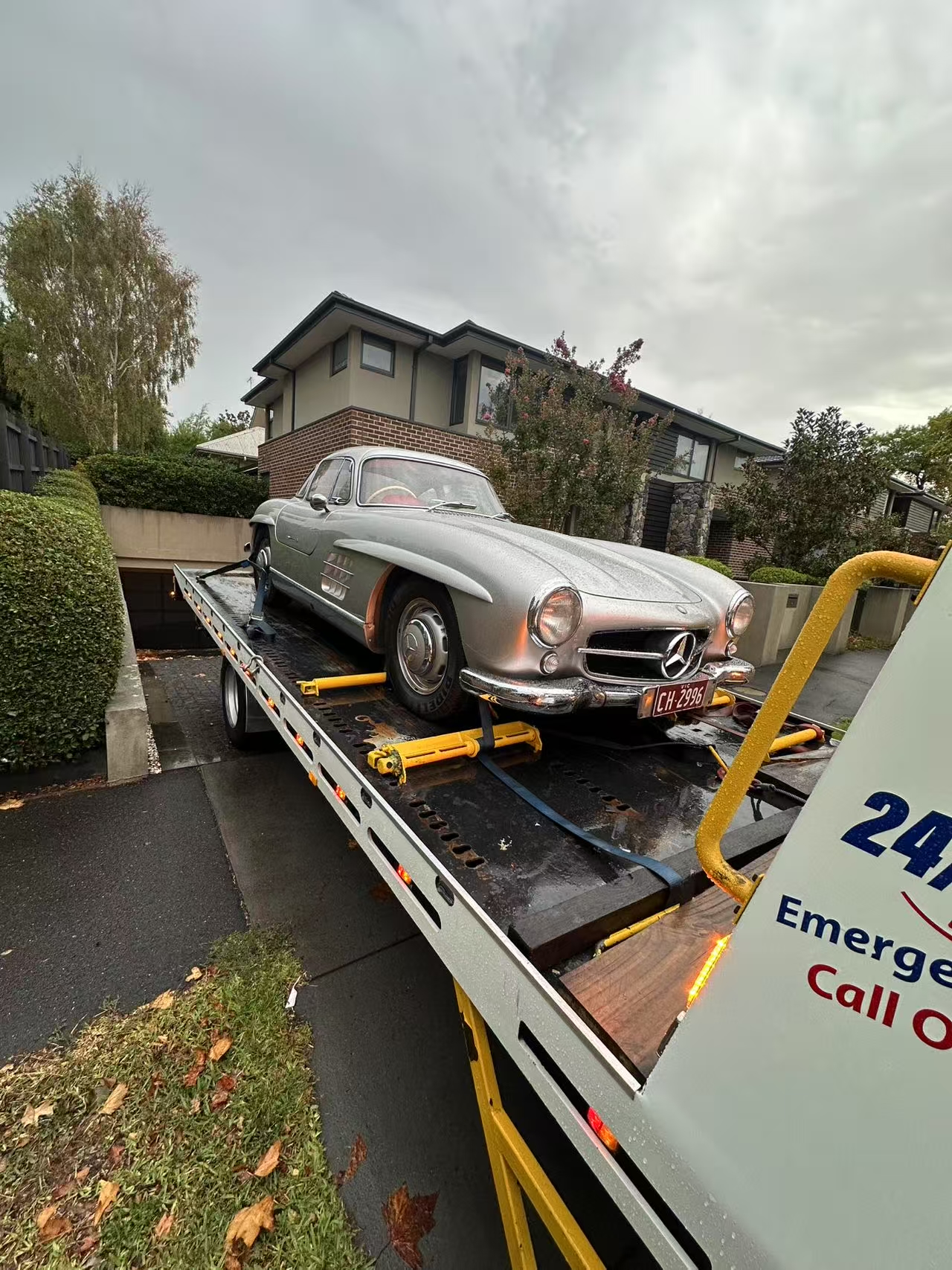 Classic Mercedes secured on a flatbed tow truck in Melbourne